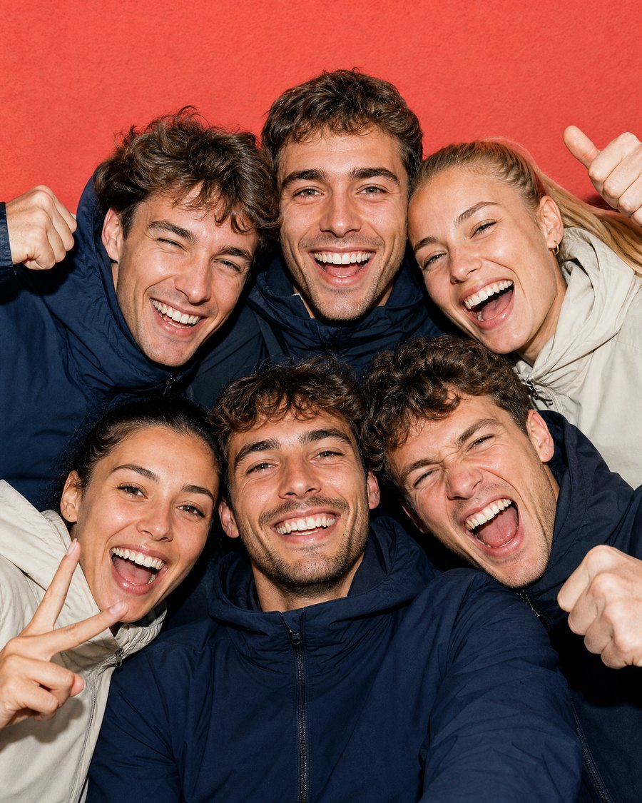 Six friends laughing together